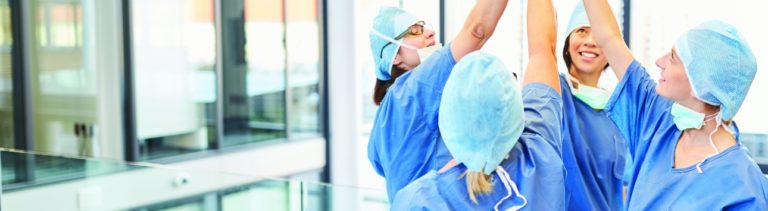 Group of medical workers high fiving