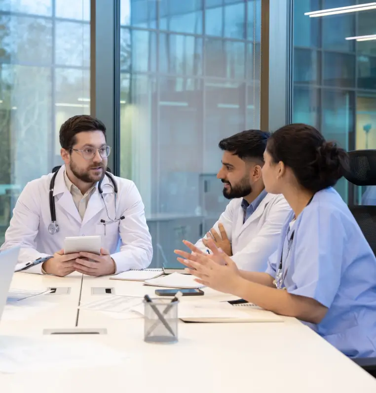 Healthcare team discussing security training and operational protocols in a conference room